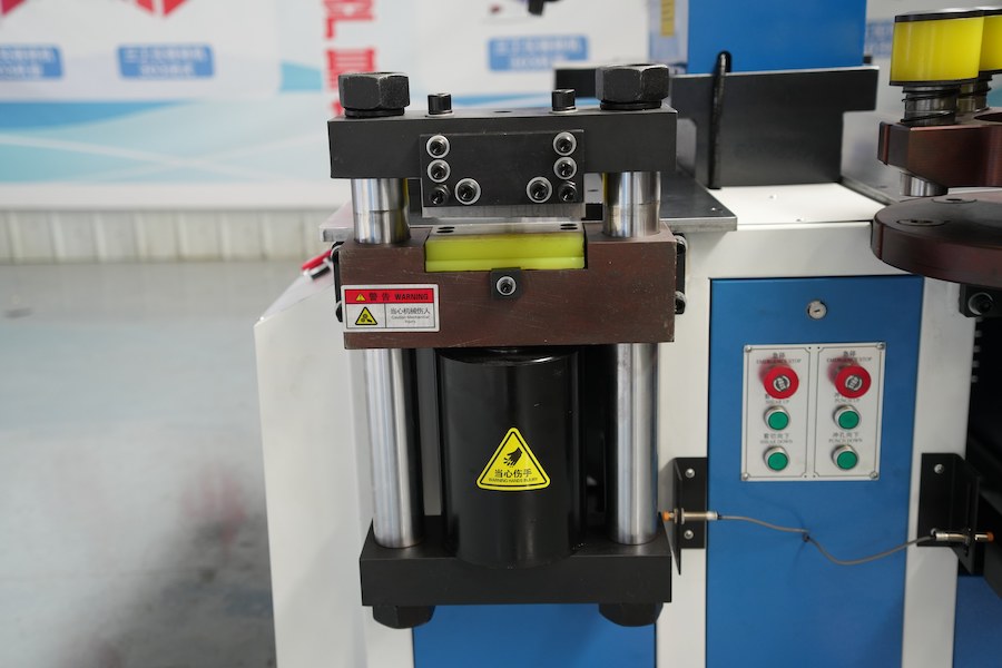 Why is the design of the oil cylinder for the bus cutting machine being enhanced?
